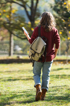 Woman traveler with smartphone in her hands