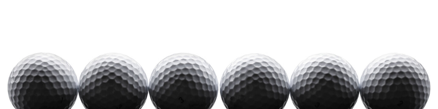 Row of multiple golf balls isolated from background