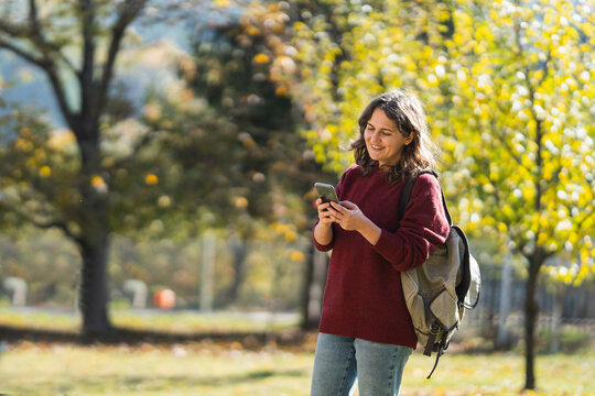 Woman traveler with smartphone in her hands