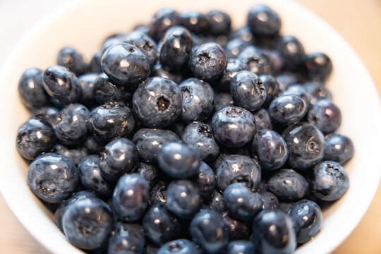 Close-up of fresh blueberries in a bowl. Sweet food, ripe, organic, ready to eat, kitchen, raw and vegetarian food.