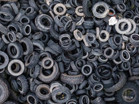 Aerial view of a large pile of discarded rubber tires stacked in a heap in Laidzes pagasts, Talsu novads, Latvia.