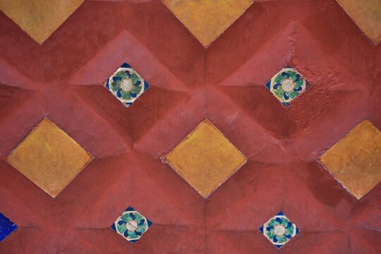 Mexican hand painted Talavera Terracotta ceramic tile wall panel on the exterior of a Colonial building in San Miguel de Allende, Guanajuato Mexico.