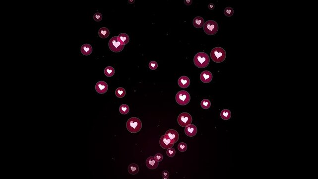 Red heart-shaped bokeh lights floating in dark night sky
