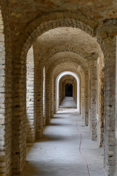 Vaulted brick arcade with receding arches in the old fortress casemates of Komarno, Slovakia