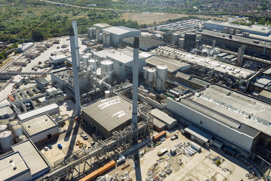 Aerial View of a Large Paper Mill Facility Operating During a Clear and Sunny Afternoon in England