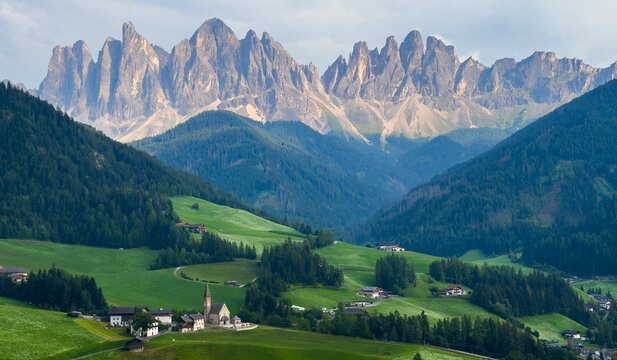 View of Val di Funes with the Chruch of Santa Maddalena in the Dolomites Mountains. UNESCO world heritage in South Tyrol, Italy 