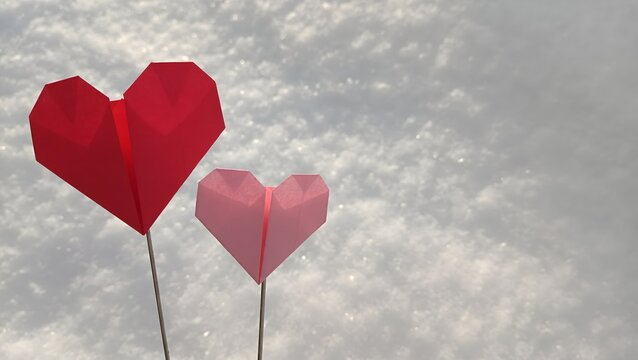 Red and pink origami paper hearts on sticks standing in white snow. Valentine's Day love concept, winter romance background copy space.