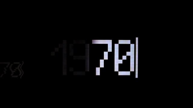 Capture: white text 1970 appear on a dark screen, reminiscent of an old CRT monitor display. Pixelated characters with a blinking cursor create a vintage computing aesthetic. Represents retro.