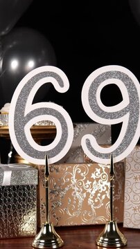 Silver Number 69 with Silver Glitter Sparkles with Gifts and Balloons and Cupcakes for Party Sixty Nine