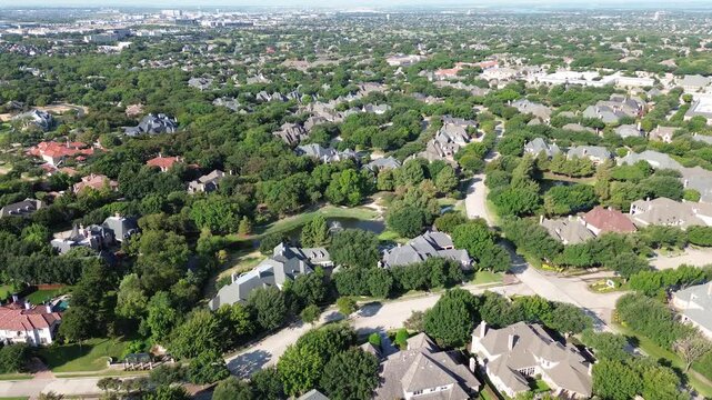Towering corporate centers rise beyond custom Starwood properties along Lebanon Road. Manicured lawns converge with winding thoroughfares, highlighting affluent residential design across Frisco, TX