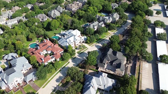 Sprawling enterprise carports border custom Starwood estates near Dallas Parkway. Gated perimeter walls separate dynamic complexes from tranquil residential yards across Frisco, Texas