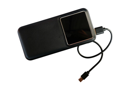 Black Power Bank External Battery Pack with USB Cable Connected for Charging Mobile Devices