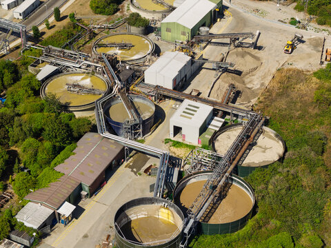 Aerial View of an Industrial Water Treatment Facility Processing Liquid Waste During a Sunny Day