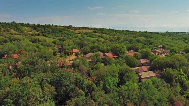 Aerial around view of old rustic vintage houses with wine cellars in Rogljevacke pivnice in Negotin region of Serbia, 4k