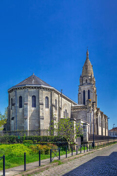 The apse and bell tower of Sainte Marie de la Bastide church in Bordeaux, France. Soft daylight shows neo-medieval style