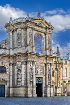 Baroque facade of Notre Dame Church with detailed stone carvings in Bordeaux, France. Bright daylight view of historical monument