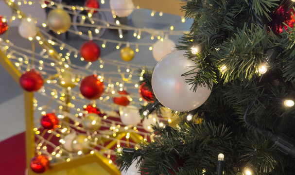 Decorated christmas tree with colorful ornaments indoors