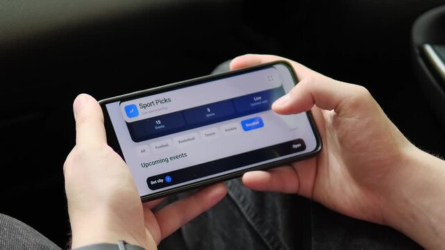 User explores live sports odds, selects an event and opens a bet slip on a smartphone, reflecting the rapid growth of mobile wagering and real-time digital gambling.