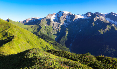 Naklejka premium Mountain green landscape with snow peak - Western Asia, South Caucasus, Republic of Georgia, Samegrelo - Zemo Svaneti.