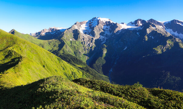 Mountain green landscape with snow peak - Western Asia, South Caucasus, Republic of Georgia, Samegrelo - Zemo Svaneti.