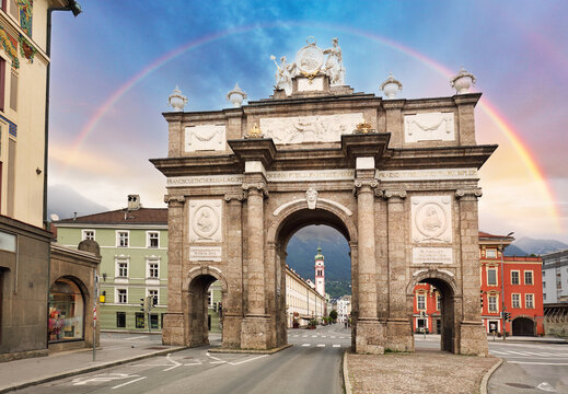 Triumphal arch in Innsbruck Altstadt Old Town. Innsbruck is the capital city of Tyrol, Austria over rainbow
