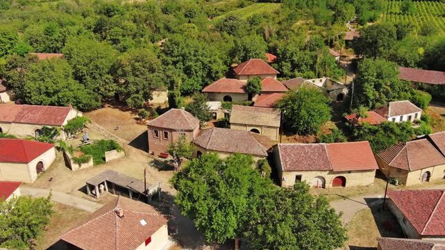 Aerial around view of old rustic vintage houses with wine cellars in Rogljevacke pivnice in Negotin region of Serbia, 4k