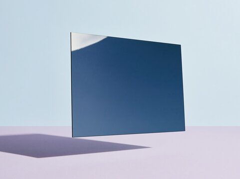 Translucent blue acetate sheet floating over a muted lavender surface, featuring a smooth polymer texture and clean edges for atmospheric design and copy space