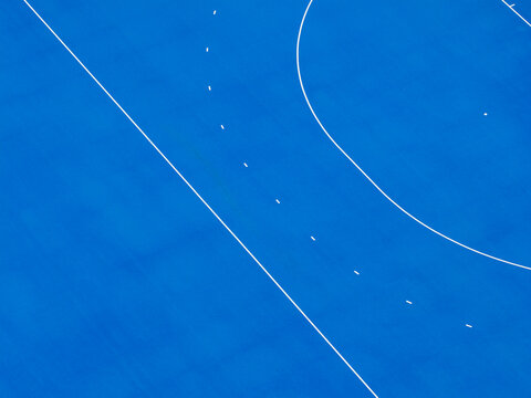 Aerial view of the blue field hockey pitch at Poznan University of Technology in Poznan, Greater Poland Voivod, Poland.