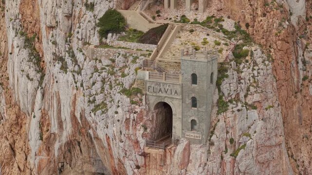 Porto Flavia Historic Cliffside Industrial Sea Harbor At Masua Near Iglesias In South Sardinia, Italy. Aerial Shot