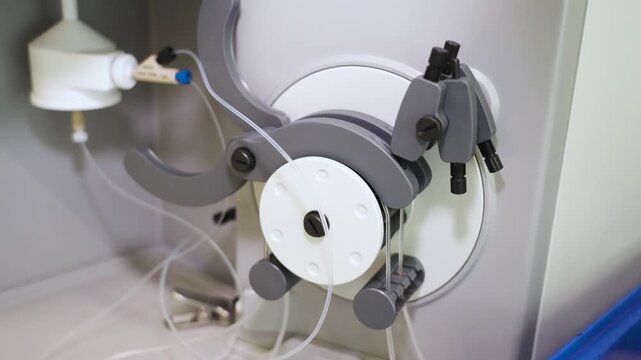 Laboratory pump with connected tubing inside a Chinese research facility, showcasing precision fluid handling equipment and scientific material testing technology, UHD