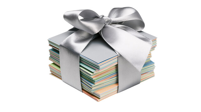 Stack of colorful paper cards tied with a silver satin ribbon bow, isolated on transparent background