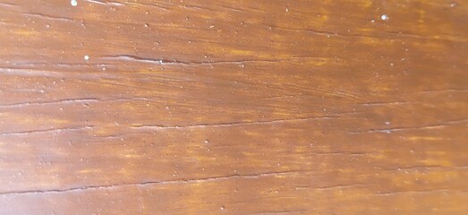 Fototapeta premium Polished Brown Wooden Surface Texture Close Up with Natural Timber Grain and Weathered Fine Cracks