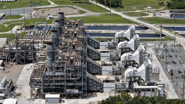 Aerial view of FPL Sanford Power Plant featuring industrial machinery, cooling towers, and complex piping systems in DeBary, Florida, United States.