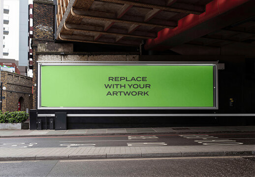 Large horizontal billboard mockup with placeholder screen mounted on a brick wall under an urban overpass, realistic outdoor advertising display for graphic design presentation, Template