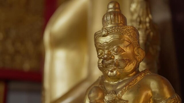 Numerous golden Buddha statues inside a serene temple hall. High-detail 4K B-roll shot showing Thai Buddhist culture, religion, and spiritual art.