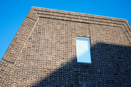 Close-up of a window in a modern brick building.