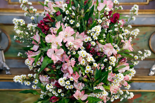 Elegant floral arrangement composed of alstroemeria flowers in pink and wine shades