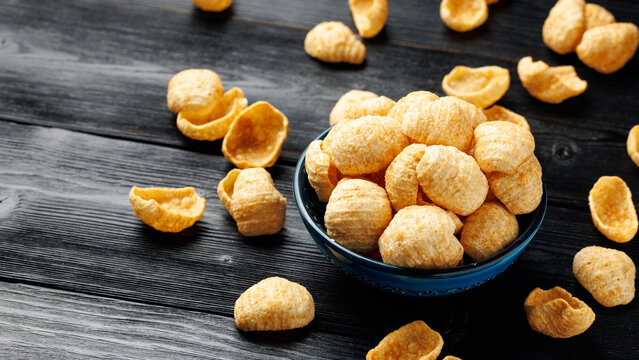 Hummus Chips Served in a Blue Bowl on Dark Wooden Table
