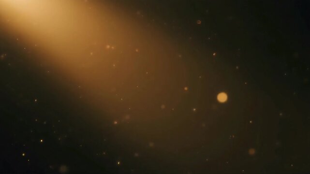 Golden light ray illuminating dust particles