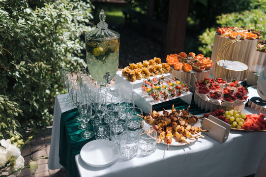 Food photography. A variety of different foods on a banquet table. Buffet. Delicious, fresh appetizers. Canapes, snacks.
