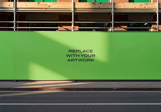 Large construction hoarding mockup with placeholder text, outdoor urban site, scaffolded brick building, street level perspective, graphic design presentation, advertising display