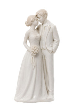 Elegant white ceramic wedding cake topper featuring a bride and groom embracing tenderly, isolated on a clean white background