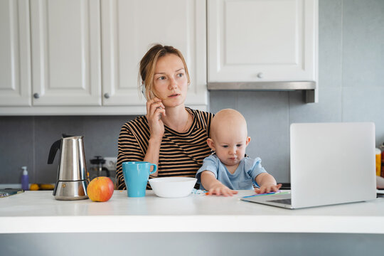 Mother balancing between work and baby on sick or maternity leave.