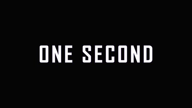 White text ONE SECOND appears with subtle purple and blue gradient overlay in cinematic motion