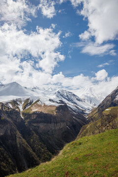 Snow covered mountains under blue sky