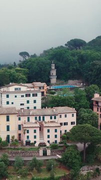 Italian village with pagoda tower and lush greenery in rapallo