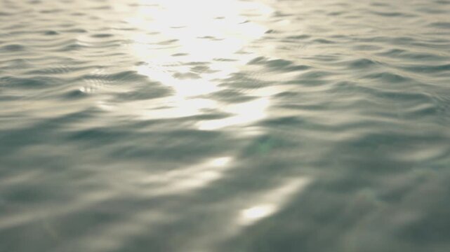 ripples on the water at sunset