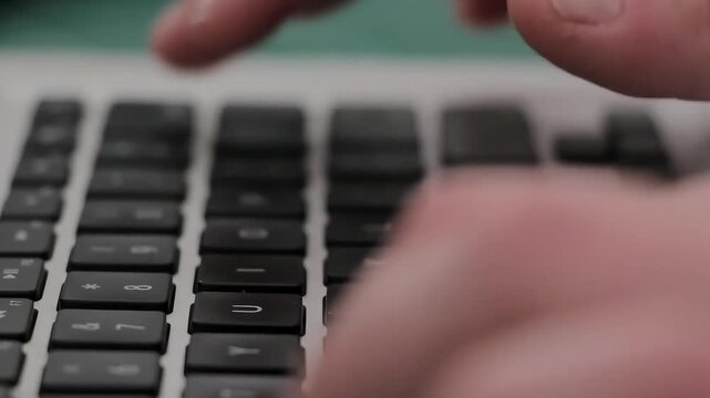 Close Up of Person Typing on Computer Keyboard in Office Environment