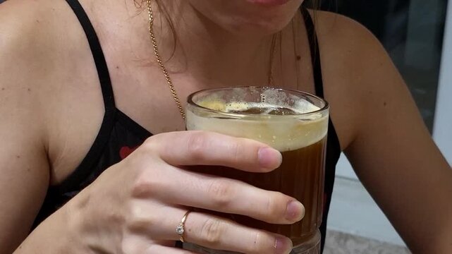 Aesthetic bumble coffee with fresh orange juice and espresso in modern cafe. Close up of refreshing summer beverage for hospitality business ad, lifestyle morning routine