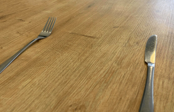 a fork and knife on a table in a restaurant